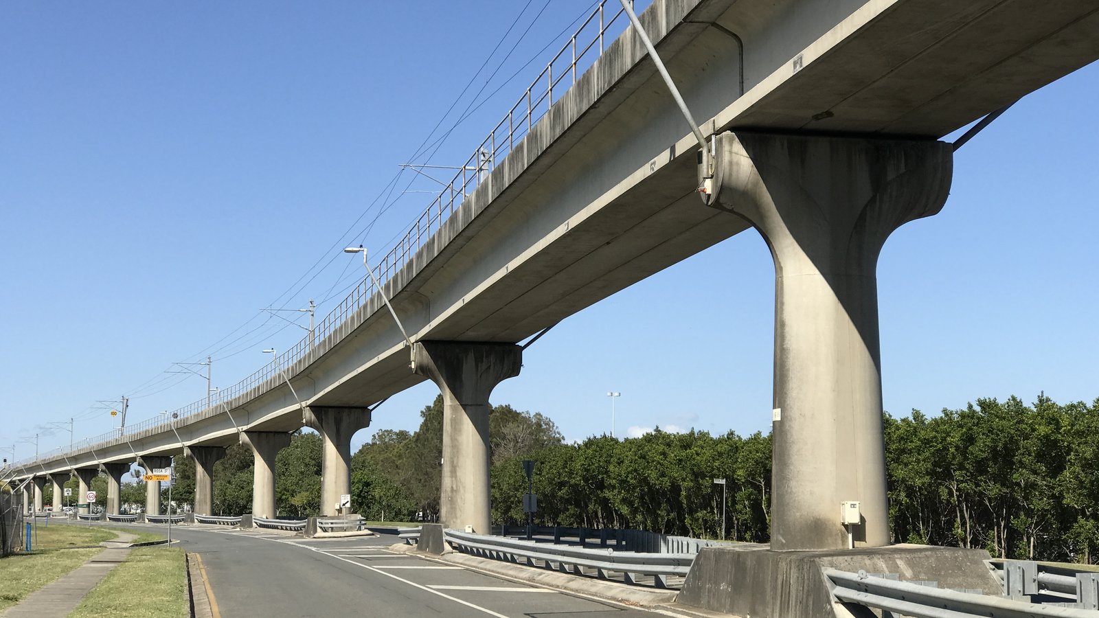 Airtrain on the elevated line above Qantas Drive at Brisbane Airport